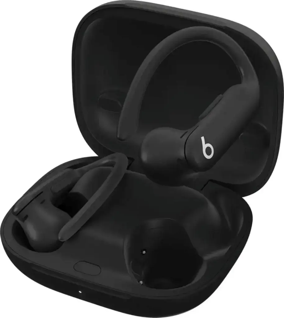 Black wireless earbuds with ear hooks resting inside an open compact charging case against a white background