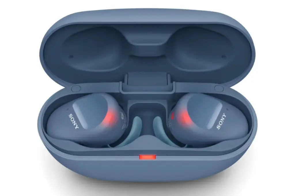 Compact blue wireless earbuds with red indicator lights inside an open matching charging case