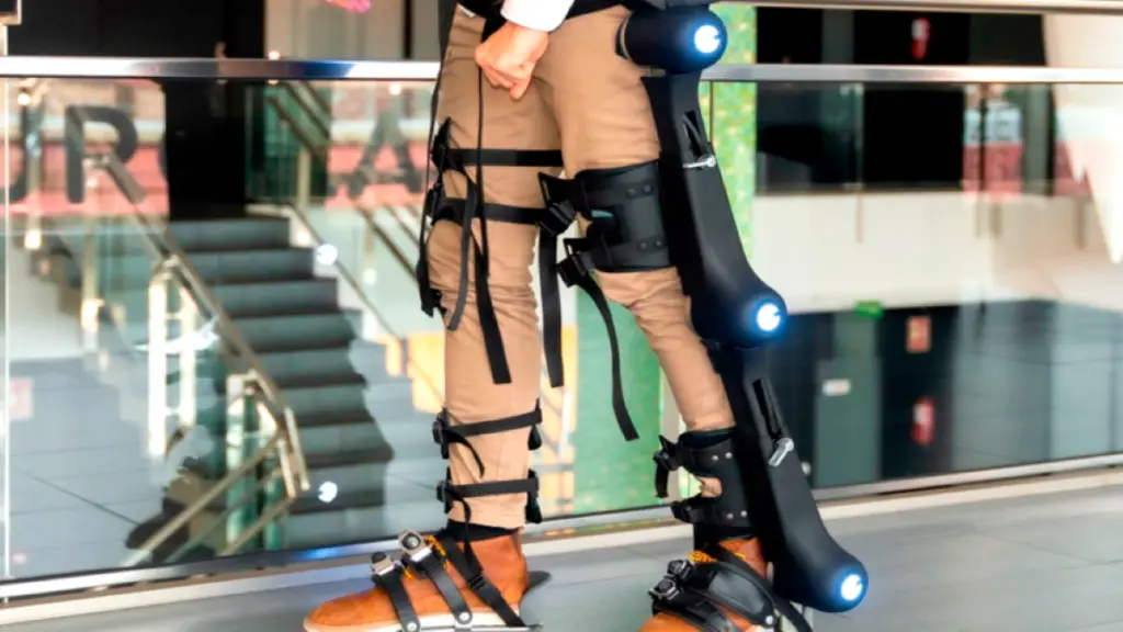 Person wearing a powered lower-body exoskeleton device with illuminated joints demonstrating assistive mobility technology at CES 2026